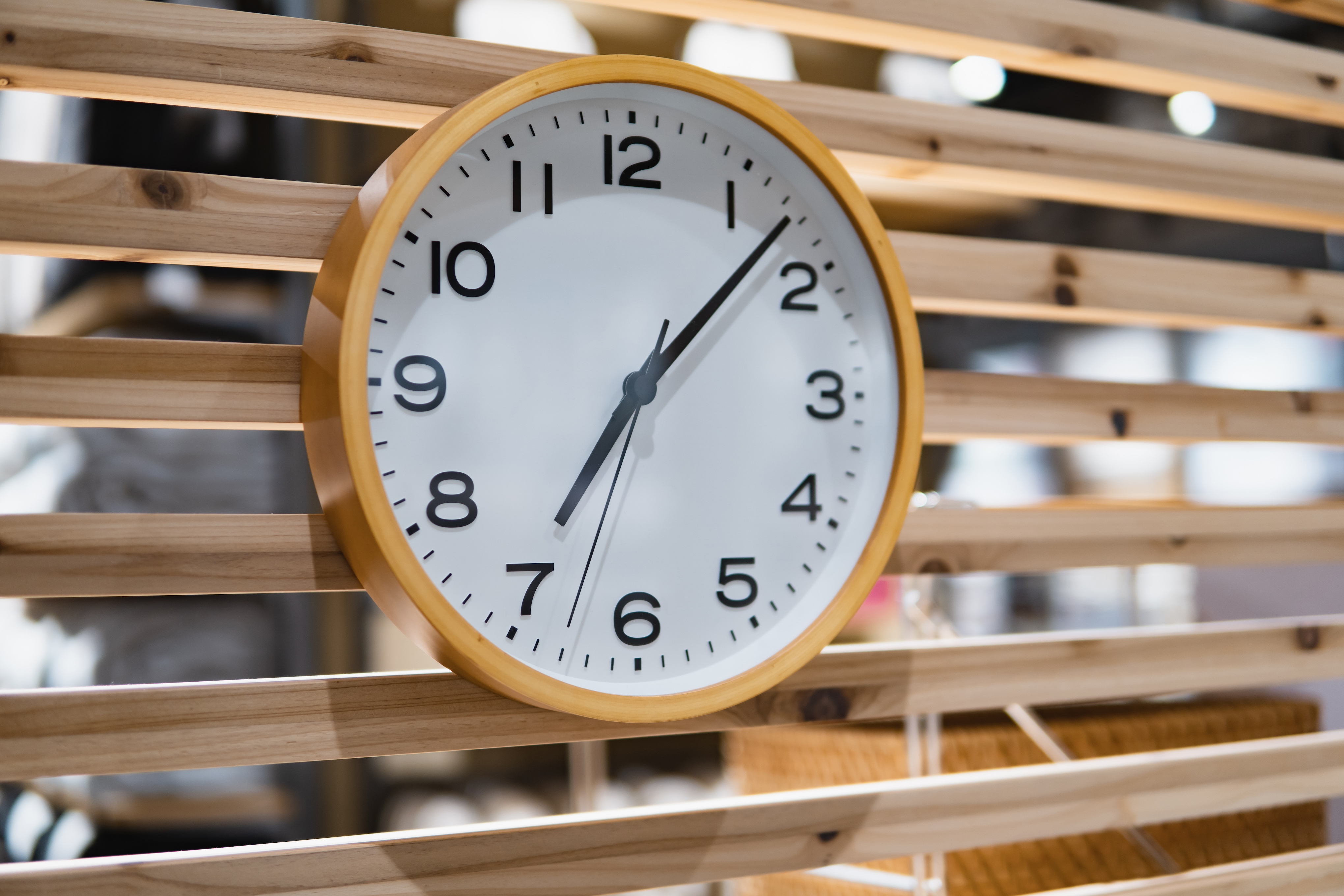 close up of clock on wood wall