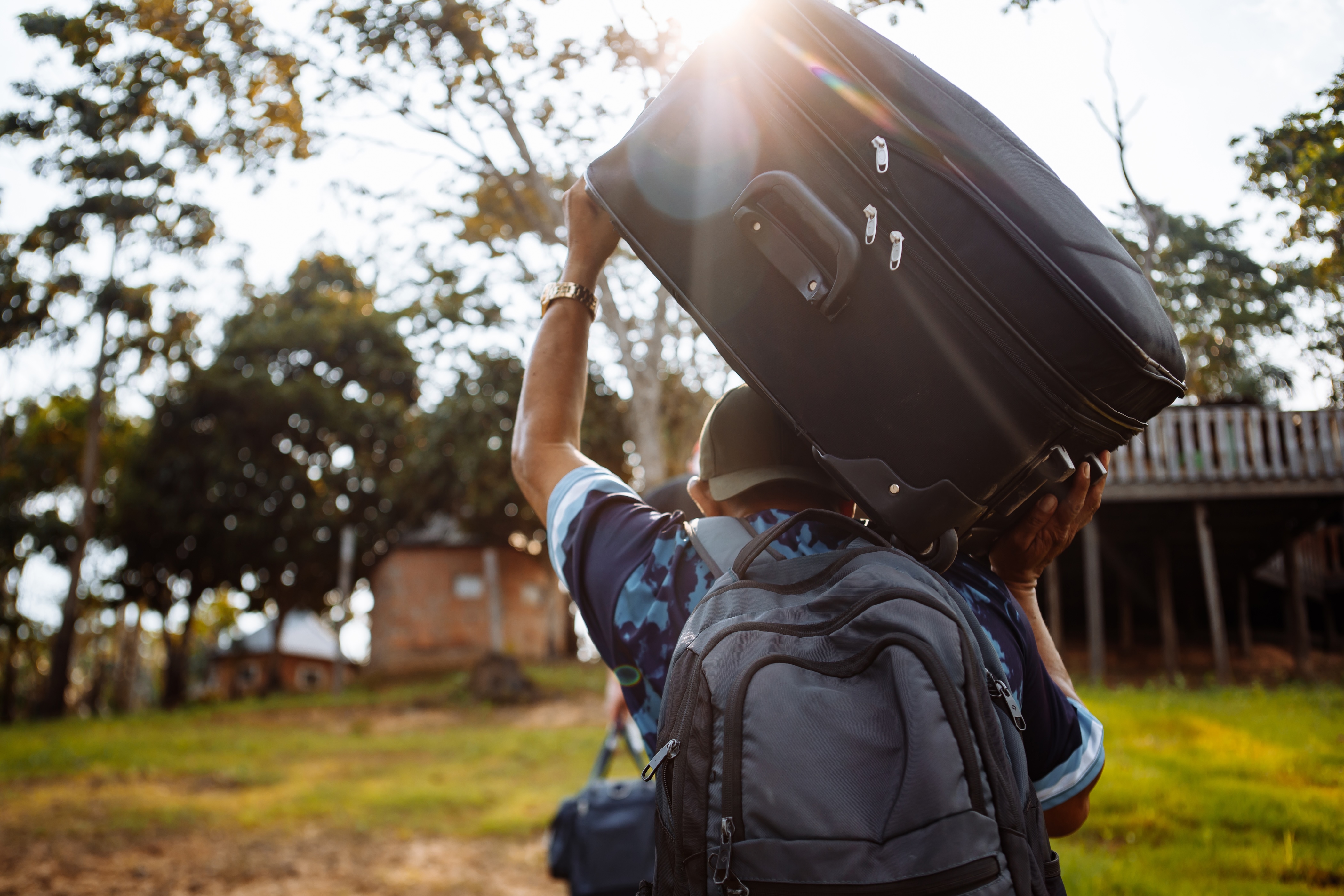 TheManCarriesASuitcase