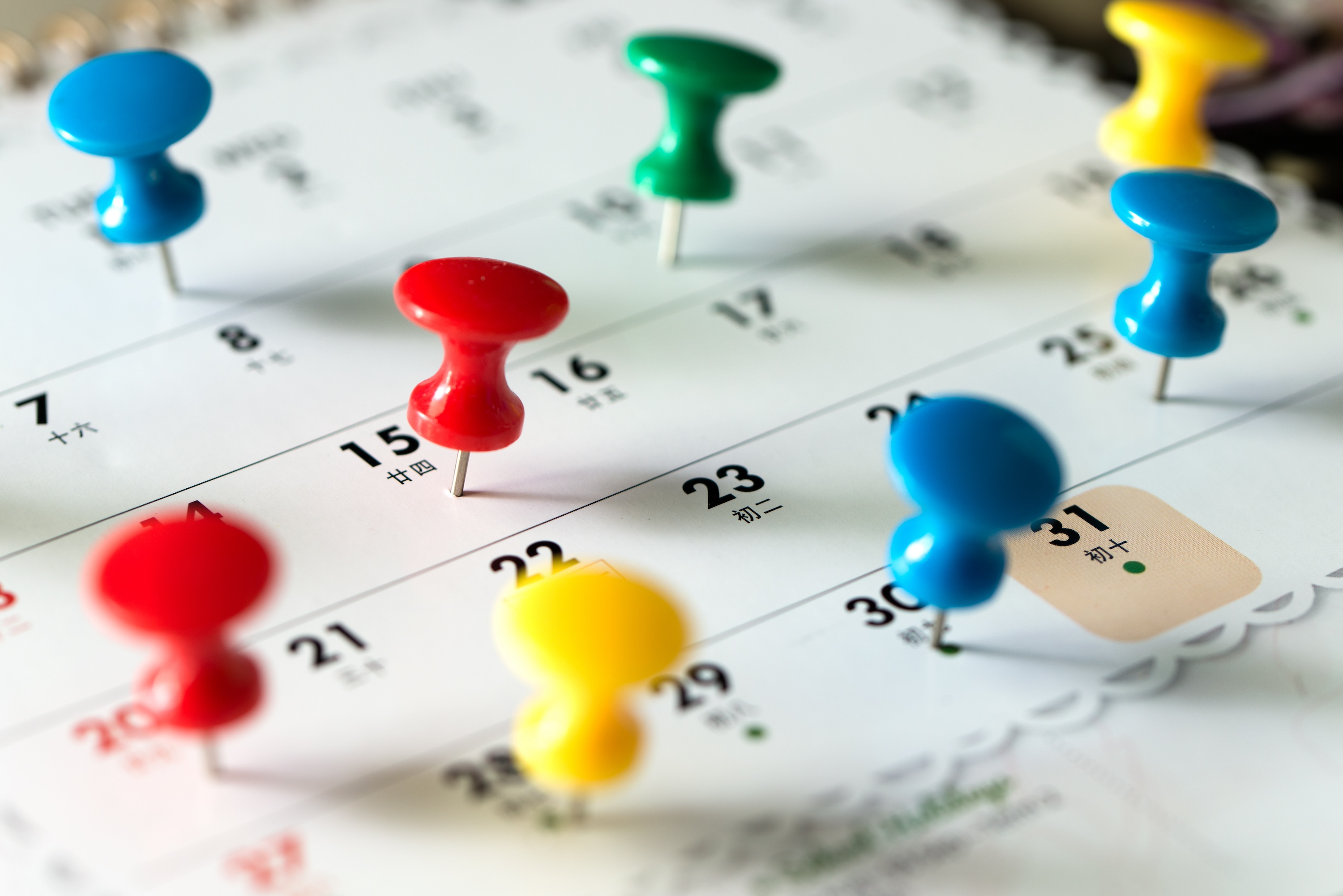 Thumbtacks on a calendar