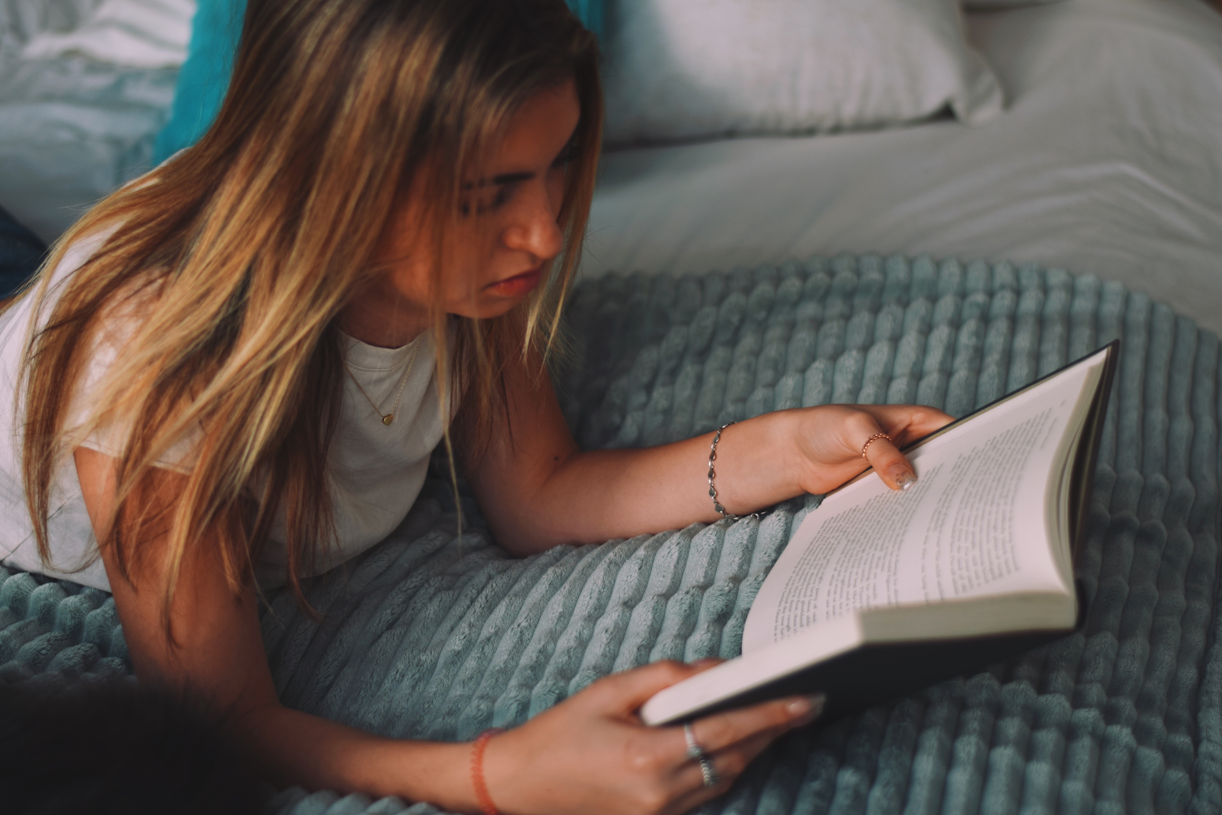 TeenGirlLayingOnBedReading TeenGirlLayingOnBedReading